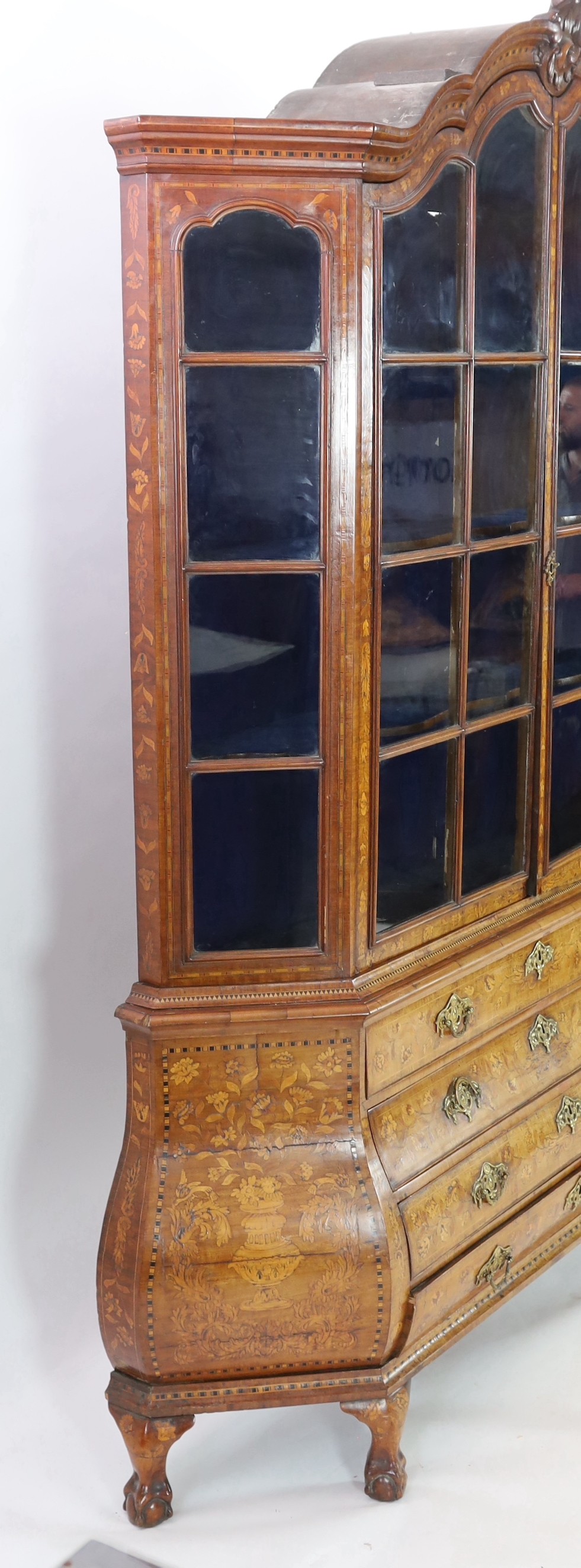 A 19th-century Dutch marquetry and walnut display cabinet Width 178cm. Height 240cm. Depth 36cm.